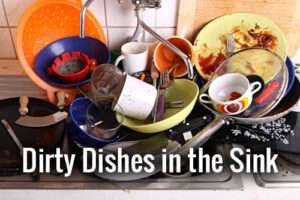 A sink full of unwashed dishes